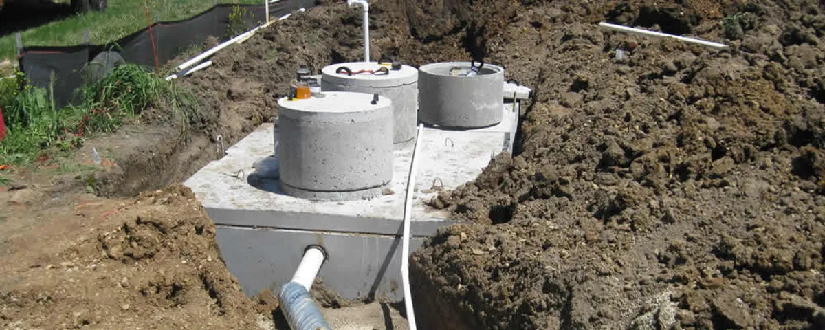 Septic system repair and installation site with tank access ports in Worcester, MA